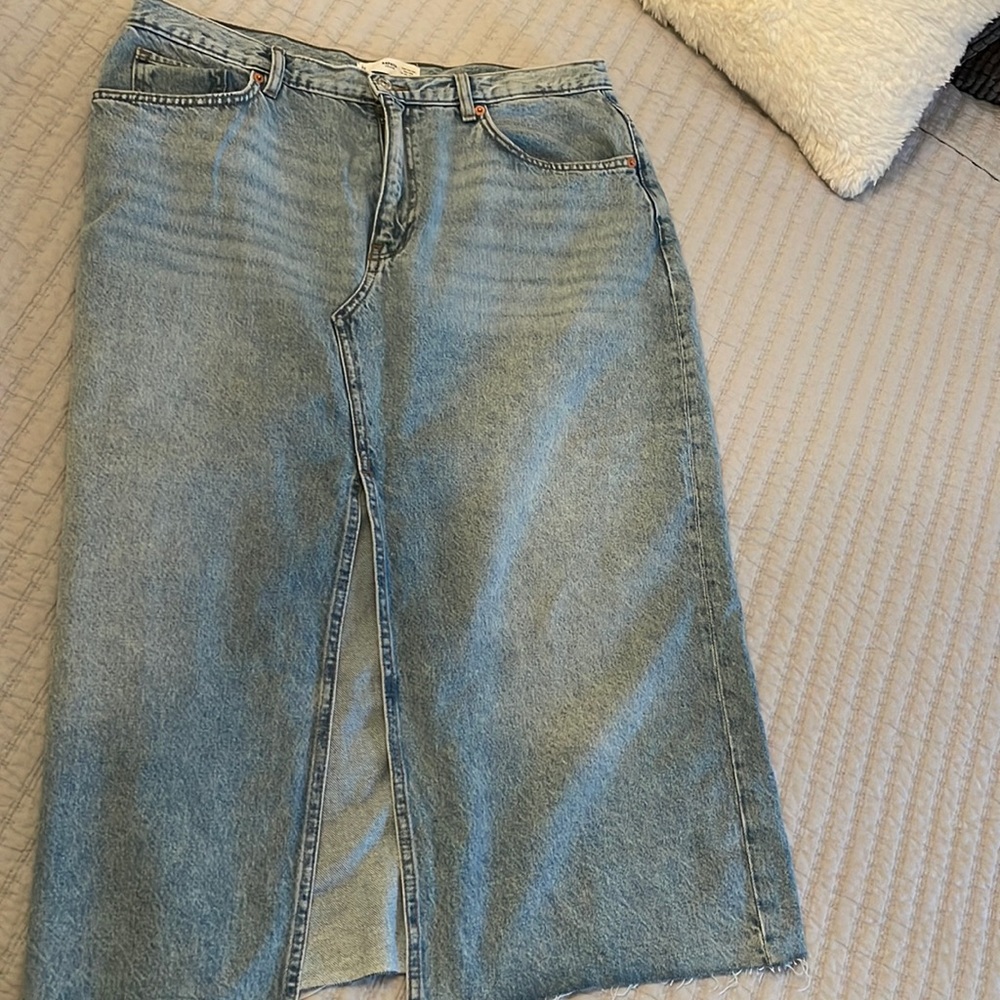 Mid length Jean skirt with slit in front